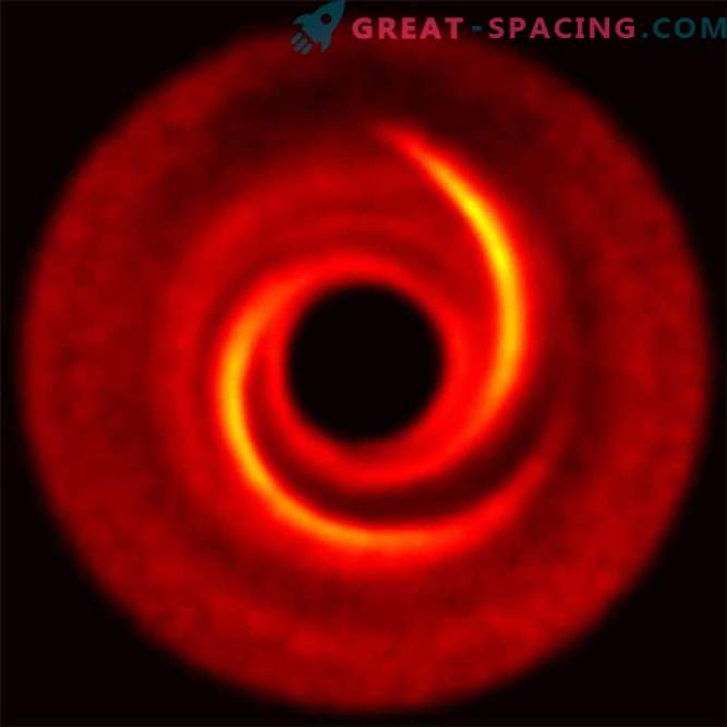Konstiga spiralarmar kan dölja framväxande planeter
